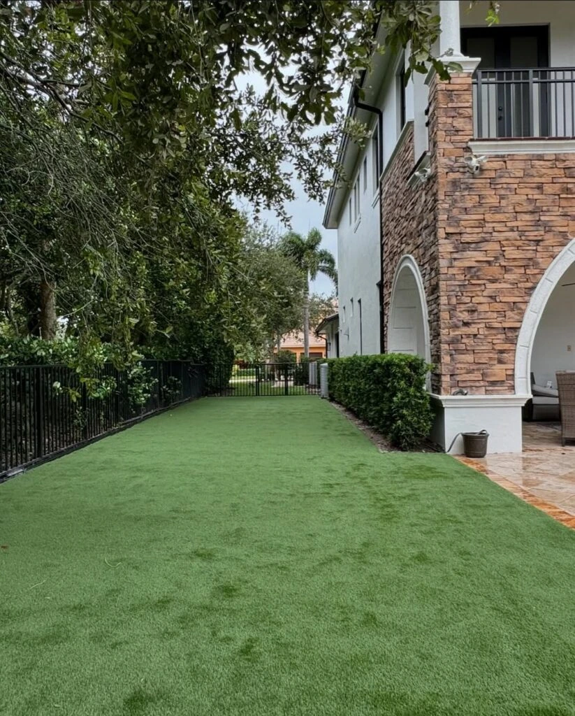 Artificial turf side yard installation at luxury estate home