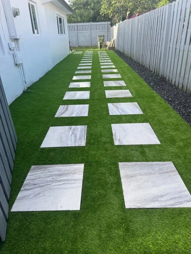 Artificial turf installation with paver stepping stone pathway