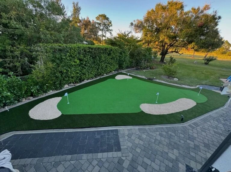 Artificial turf putting green installation with sand bunkers