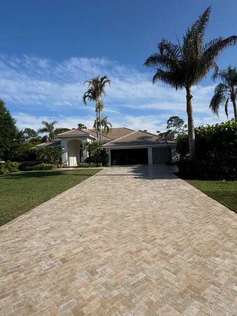 Long herringbone paver driveway installation