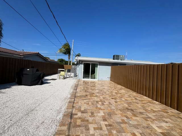 Travertine paver patio installation